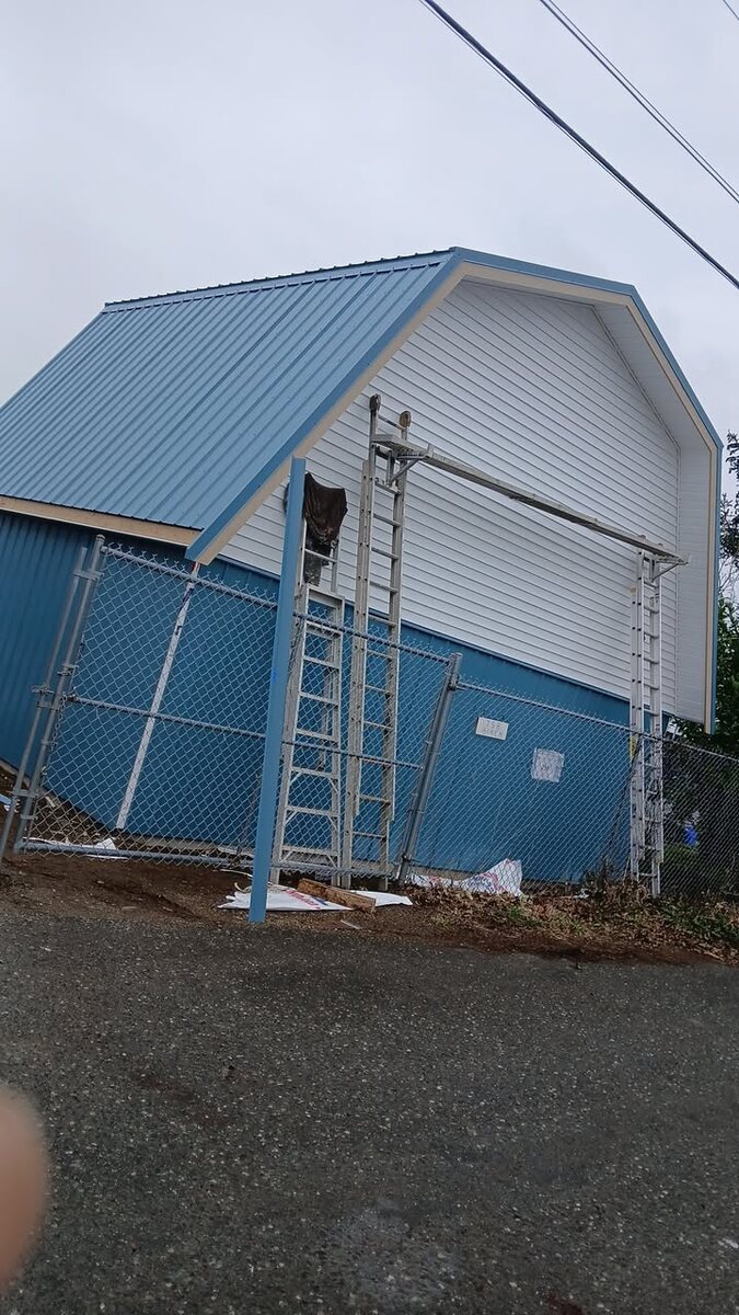 Blue metal roof on a steep gable building