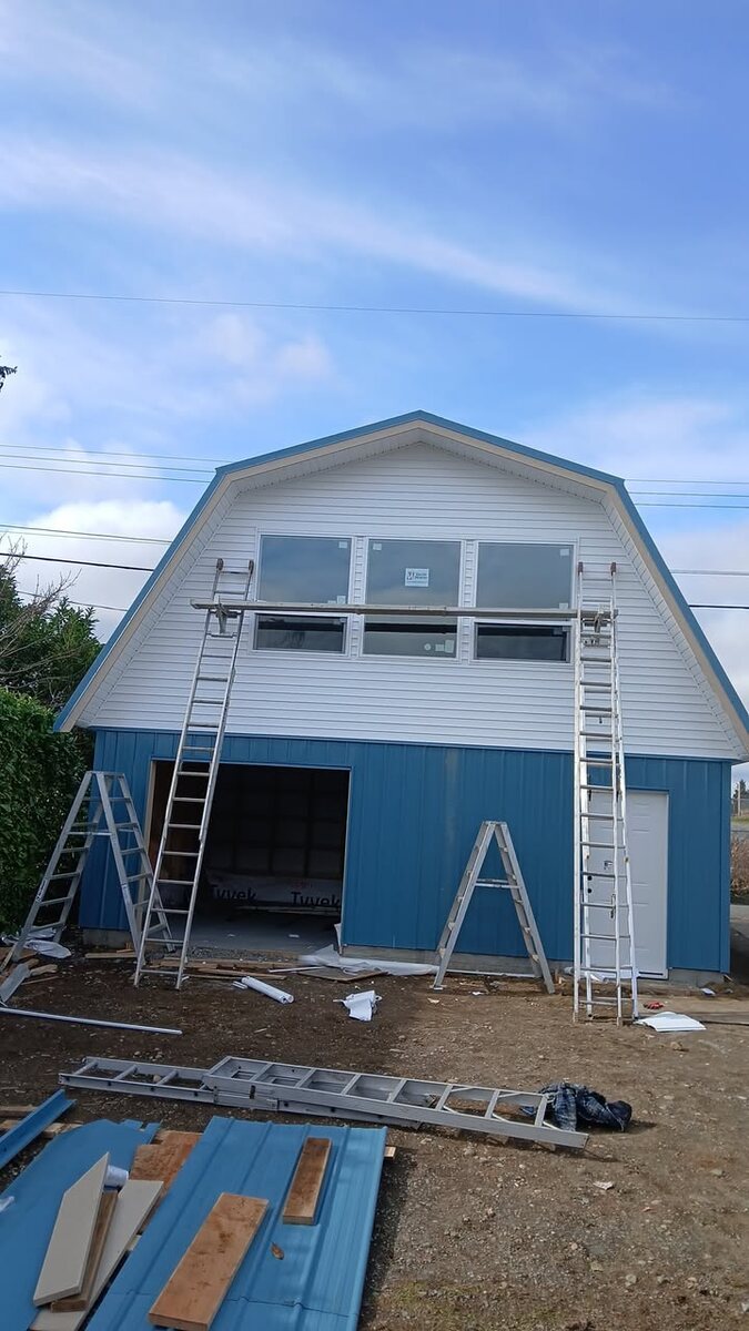 Building front with blue metal roofing and cladding